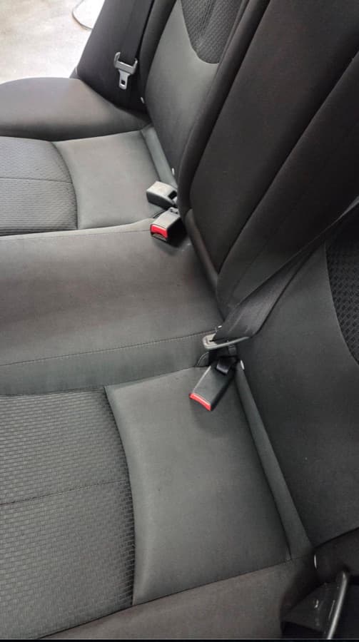 Sedan rear seat fully cleaned after stain extraction by a mobile detailer