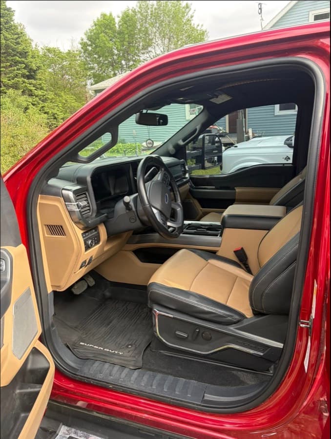 Detailed interior of a Ford Super Duty with two-tone tan and black leather seats