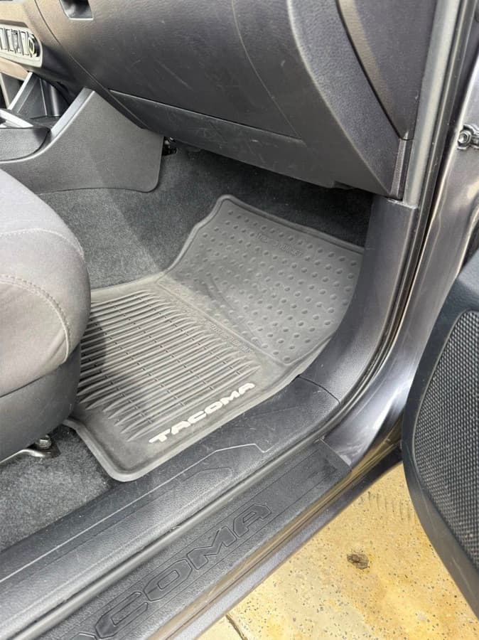 Clean Toyota Tacoma driver-side floor mat after a mobile interior detail